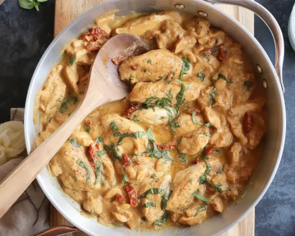 Whole30 Marry Me Chicken served with fresh herbs and vegetables