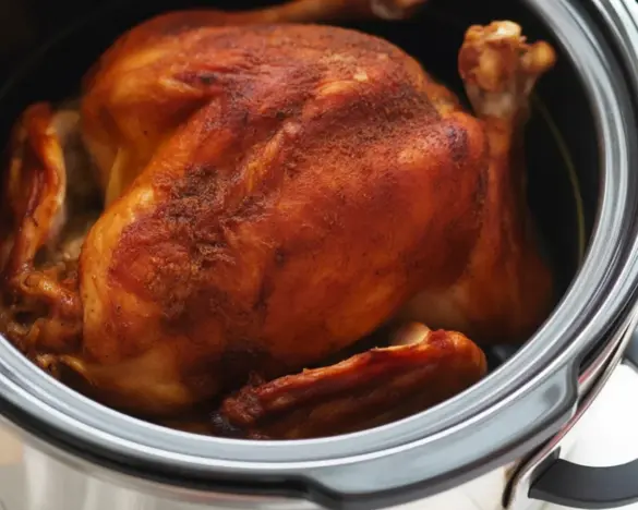 Crockpot Rotisserie Chicken served with herbs and spices