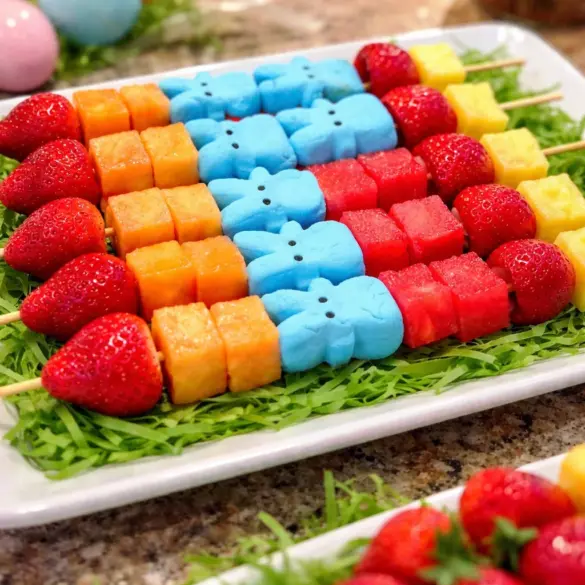 Colorful Easter Rainbow Fruit Kabobs with assorted fresh fruit skewered on sticks
